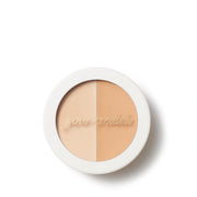 Jane Iredale Circle Delete Concealer 1 2,8g in ronde witte verpakking met twee tinten voor het neutraliseren van roodheid.