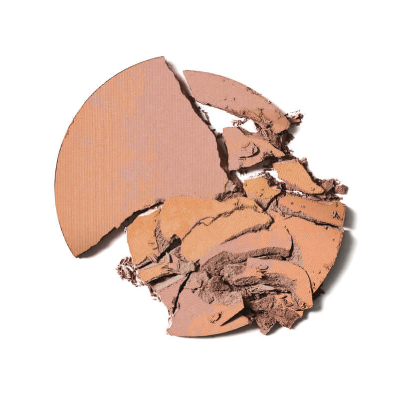 Delilah - Pure Light Illuminating Powder Aura gebroken bronspoeder met luxe textuur en warme tinten, perfect voor een stralende gloed.
