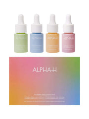 Alpha-H Vitamin Discovery Kit 4x 10ml met groene, blauwe, oranje en roze serumflessen voor huidverzorging.