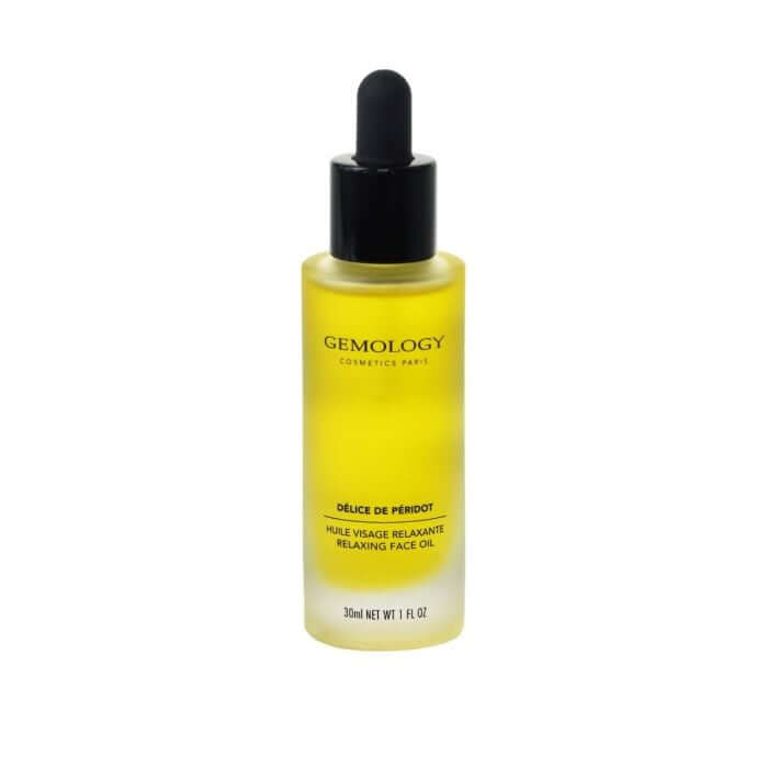 Gemology - Relaxing Face Oil 30ml in een elegant glazen flesje met pipet, gevuld met een heldere gele olie.