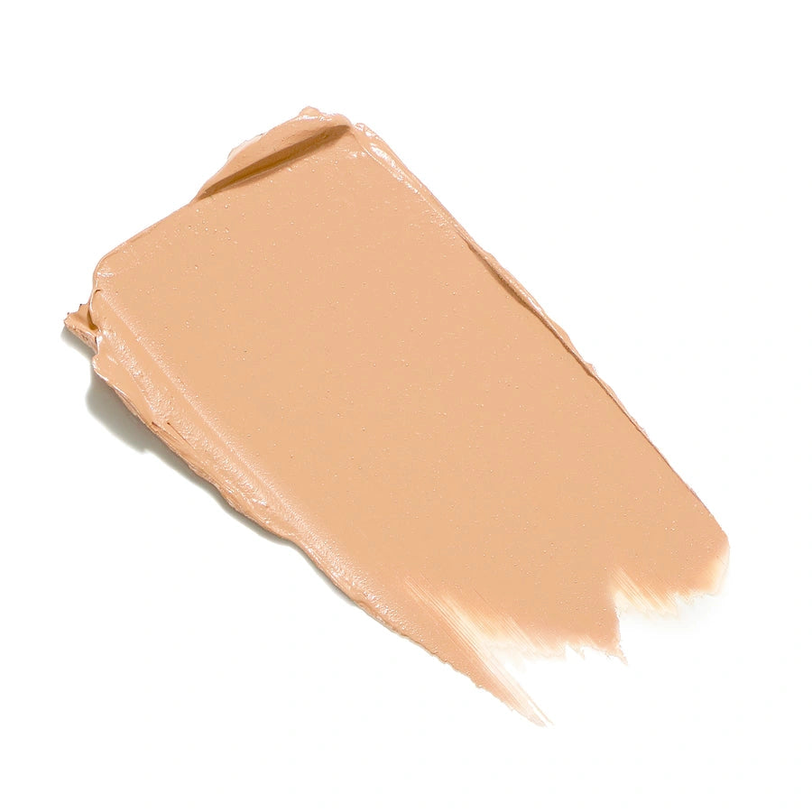 Jane Iredale Enlighten Plus Under-eye Concealer SPF30 No. 0 7ml, lichte huidtint textuurschade op wit oppervlak.