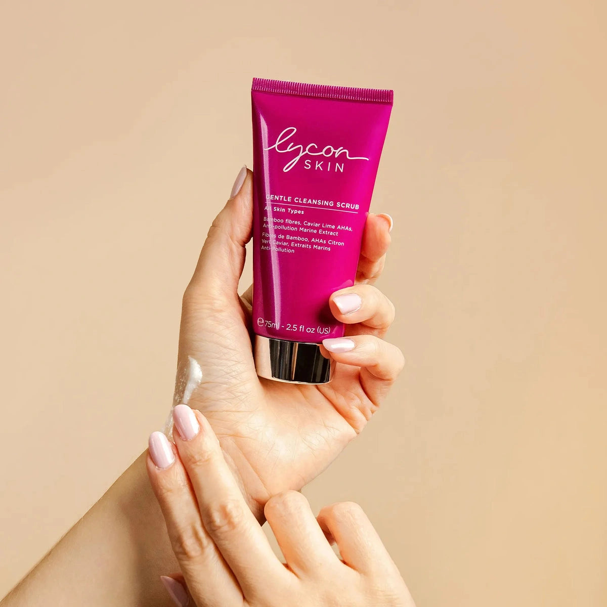 LYCON Skin Gentle Cleansing Scrub 75ml in hand with smooth texture on fingers, showcasing vibrant packaging and exfoliating properties.