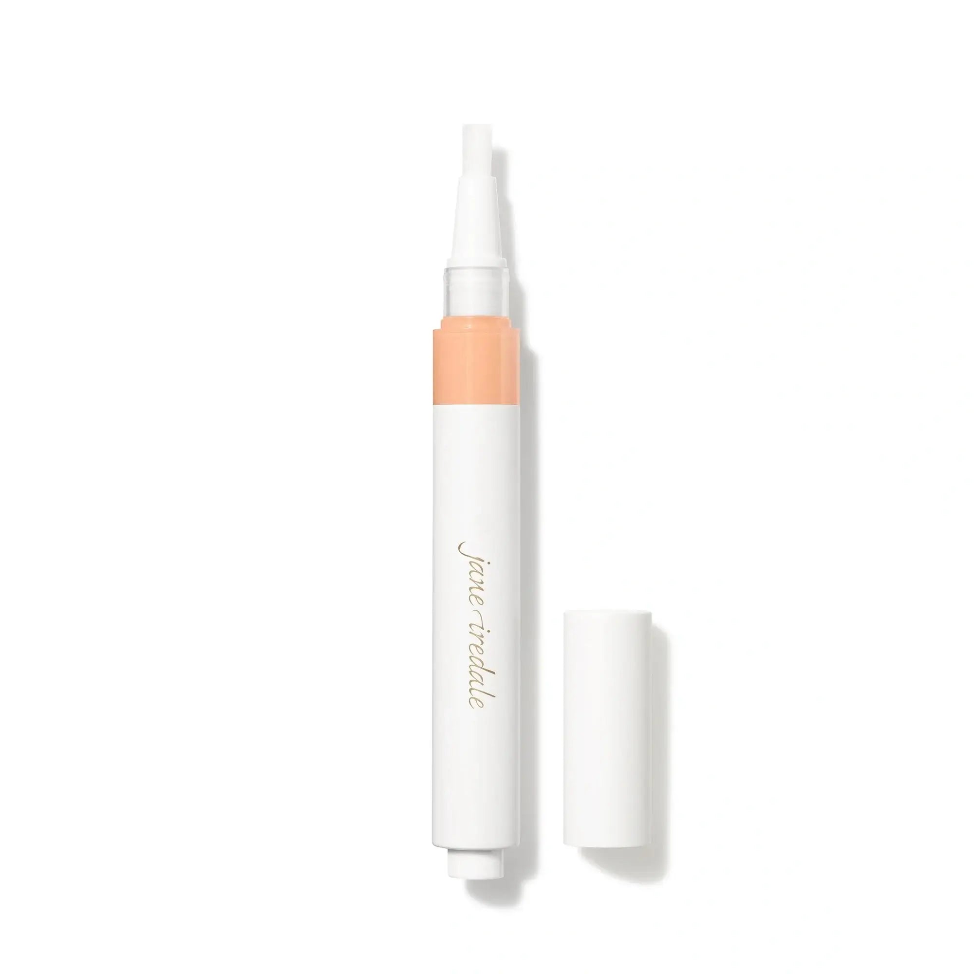 Jane Iredale Skintuition Brightening Under Eye Concealer LM5 in witte pen met een perzik kleur, ideaal voor licht-medium huid met roze ondertoon.