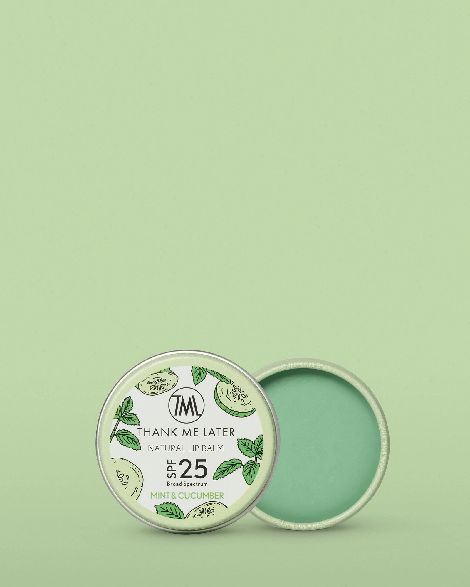 Thank Me Later Natural Lip Balm SPF25 Mint Cucumber 10g in open tin with green balm and fresh mint design