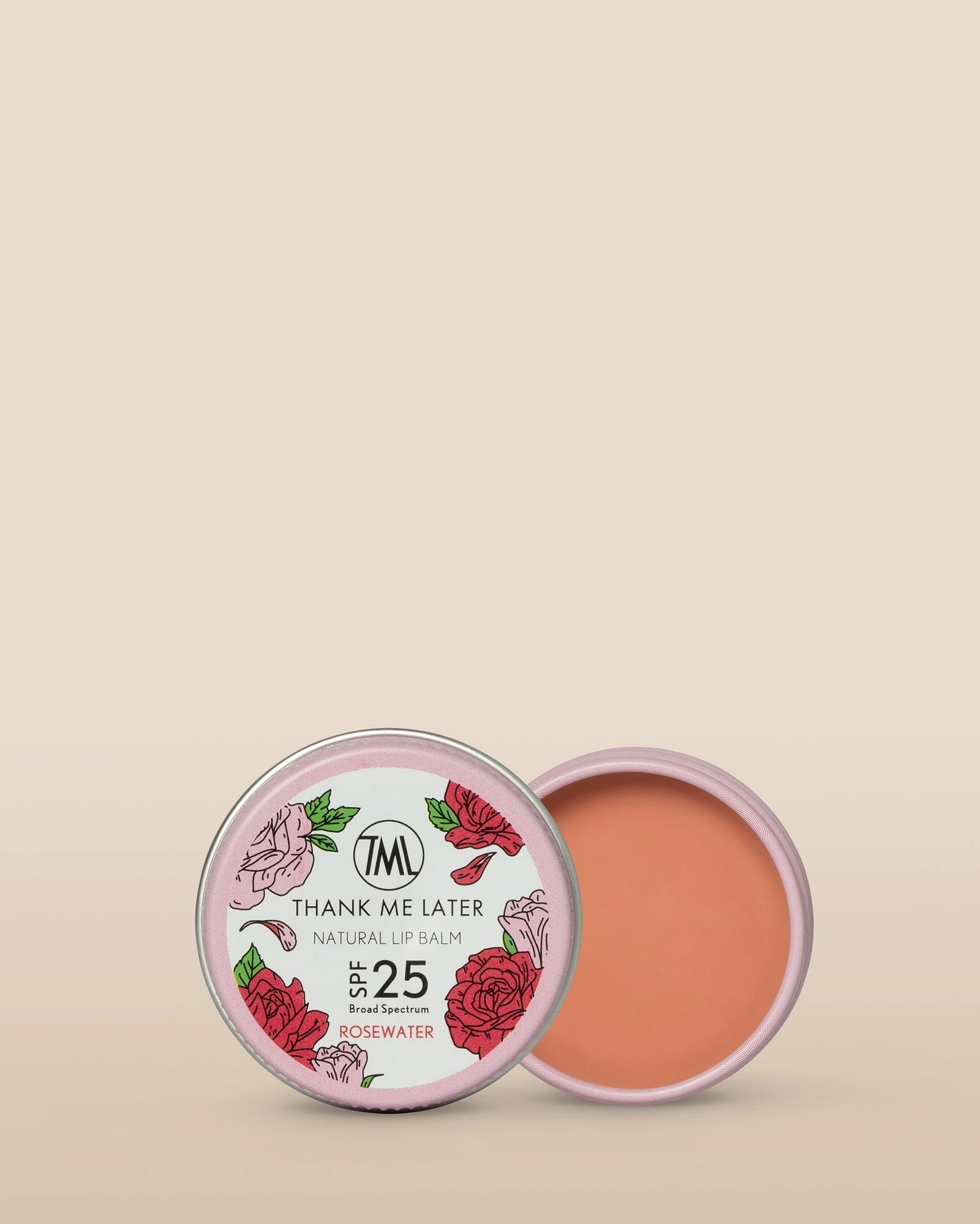 Thank Me Later Natural Lip Balm SPF25 Rosewater 10g in a stylish pink tin with floral design, showcasing the creamy texture.