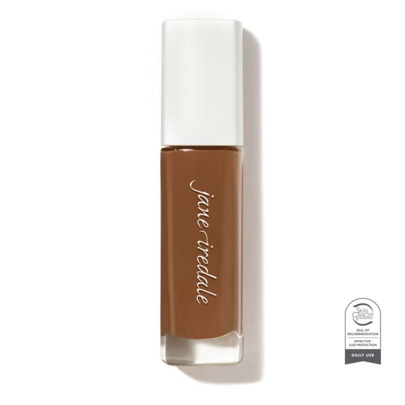 Skintuition SPF30 Radiance Boosting Liquid Foundation 64 Dark 30ml in een stijlvolle glazen verpakking, ideaal voor een stralende huid.