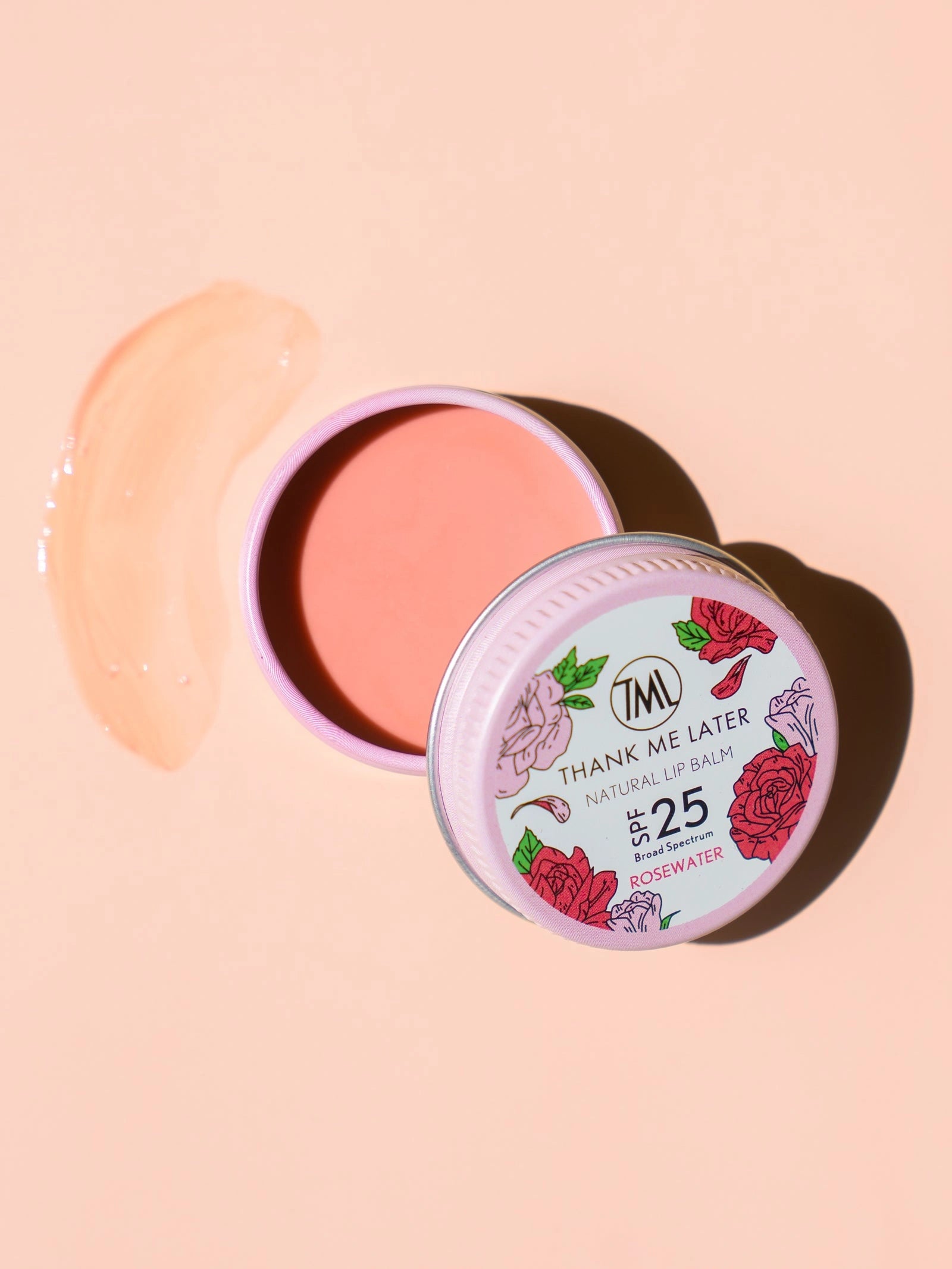 Thank Me Later Natural Lip Balm SPF25 Rosewater 10g in een roze pot met gladde lippenbalsem en een rozenwater textuur.